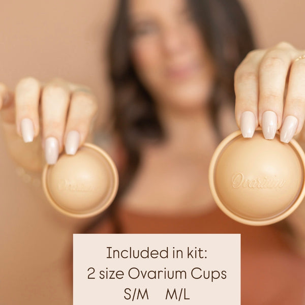 woman holding small medium large conception cups patented medical grade silicone natural hormone-free