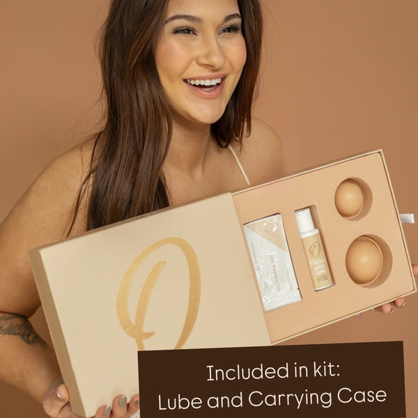 woman holding ovarium conception kit with conception cups and fertility sperm-friendly lubricant FDA